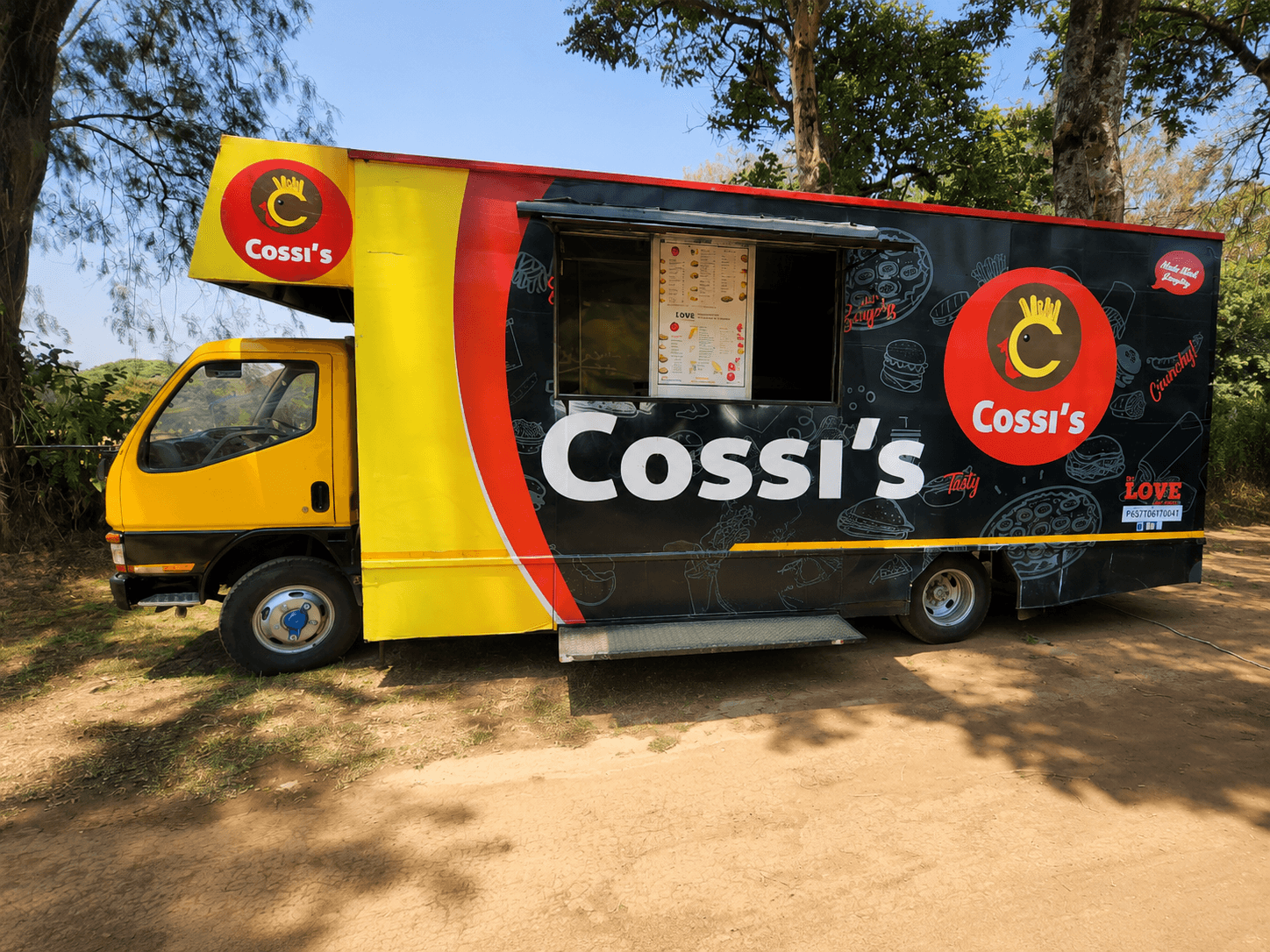 The branded Cossi's food truck parked outdoors